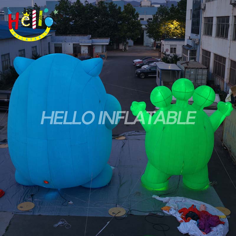Giant LED Inflatable Monster Mascot Set, Custom Large Green Three-Eyed and Blue One-Eyed Cartoon Creatures for Event Decoration and Advertising