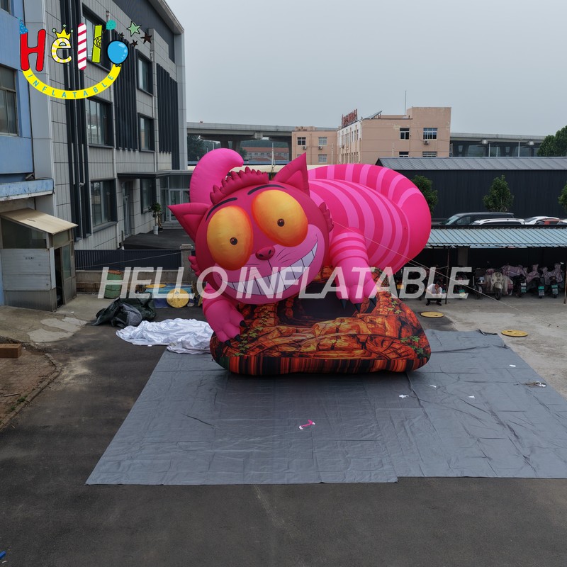 Giant Custom Inflatable Cheshire Cat with Striped Tail, Large Smiling Pink Fantasy Cat Character on Rock Base for Amusement Park and Mall Event Decoration插图 Giant Custom Inflatable Cheshire Cat with Striped Tail, Large Smiling Pink Fantasy Cat Character on Rock Base for Amusement Park and Mall Event Decoration
